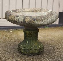 A well weathered stoneware bird bath, 36cm high.