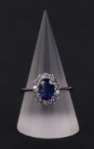 A certificated 18ct white gold oval Kyanite and diamond cluster ring, Kyanite approx 1.77ct,