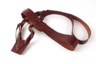 A brown leather Sam Browne belt, with sword frog.
