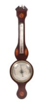 A George III mahogany wheel barometer, with inlaid shell decoration and thermometer, 97cm high.