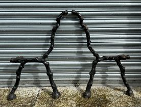 A pair of cast iron crabstock form bench ends, 86cm high.