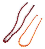 A graduated string of cherry amber like Bakelite beads, approx 50cm long, largest bead 10mm long,