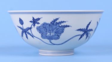 A Chinese blue and white footed bowl, decorated with scrolling and flowers with six character blue