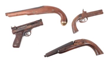 A vintage Webley air pistol, a double barrelled percussion pistol, the remains of a flintlock