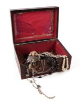 A quantity of costume jewellery in a rosewood box.