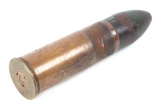 A WWI inert German artillery shell. Date stamp to the base: JULI 1918. Overall height 17cms (6.