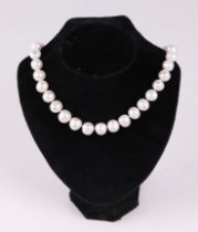 A cultured pearl bead necklace, with 9ct white gold ball clasp, 45cm long, pearls each approx 15mm
