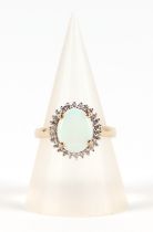 A 9ct gold opal and diamond cluster ring, approx UK size L, 2.2g