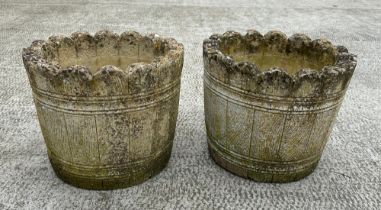 A pair of well weathered stoneware barrel form garden planters, 39cm wide.