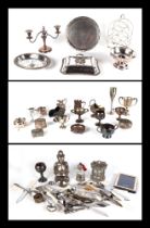 A quantity of silver plated items, including trophy cups, tankards, entrée dishes and other items.