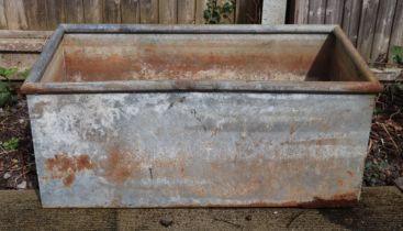 A galvanised rectangular planter, 95cm wide.