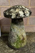 A well weathered staddle stone, 77cm high.