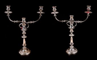 A pair of twin branch silver plated candelabra, 50cm high.