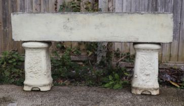 A stone rectangular planter, on two square column supports, 107cm wide.