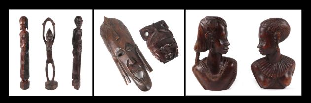 An African carved hardwood female fertility figure, 62cm high, a man holding a staff, 62 cm high,