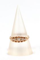 An 18ct gold five stone diamond ring, approx UK size O, 2.8g.