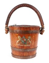A 19th century copper bound oak peat or fire bucket, with Royal Coat of Arms and original leather