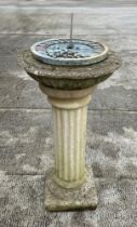 A well weathered stoneware garden sundial, 80cm high.