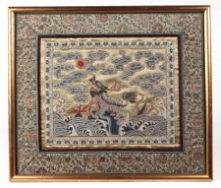 A Chinese silk embroidered rank badge, depicting a lion within a landscape, 42 by 36 cm. Condition