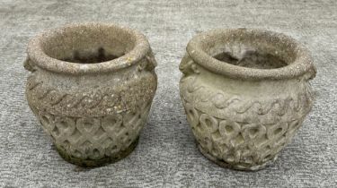 A pair of well weathered stoneware garden planters, 30cm diameter.