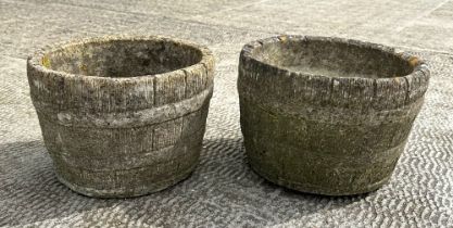 A pair of half barrel form well weathered stoneware garden planters, 30cm diameter.