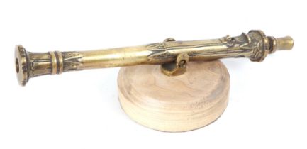 A cast brass Lantaka Cannon mounted on a hardwood base. Overall barrel length 44cms (17.25ins)