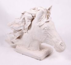 A plaster cast sculpture in the form of a horses head, approx 80cm wide.