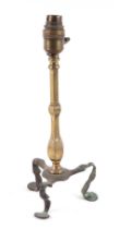 A brass tripod pullman type lamp, 32cm high. Condition Report One of the legs has been replaced.