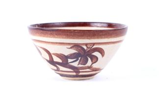 A Chinese pottery bowl, decorated with bamboo, 11cm diameter.