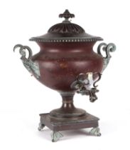 A copper samovar, with porcelain carrying handles, approx 46cm high.