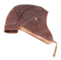 A brown leather Flying or Driving helmet with elasticated chin strap. No makers name.