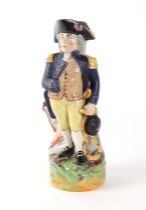 A Staffordshire pottery figural water jug, depicting Lord Nelson, 29cm high.