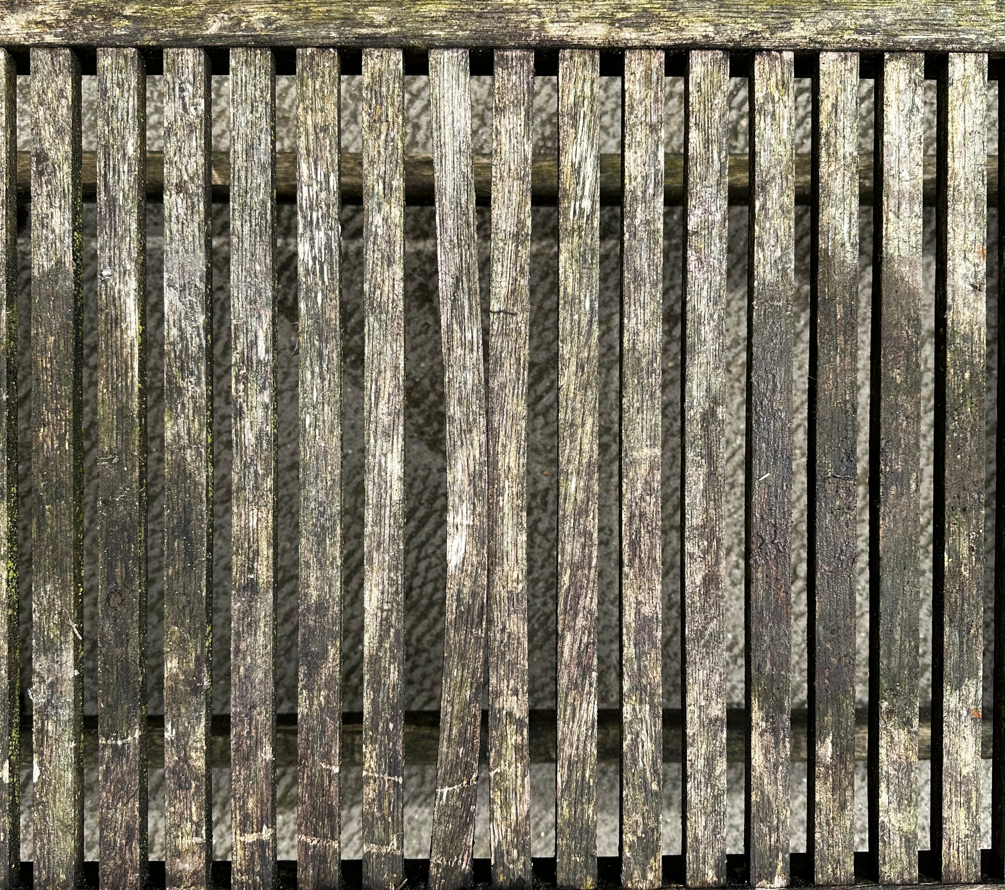 A well weathered teak garden coffee table, 98cm wide. Condition Report There are two slats which are - Image 2 of 2