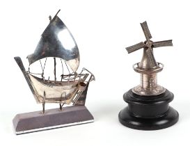 A 925 silver model of a fishing boat, together with a Dutch white metal model of a windmill (2).