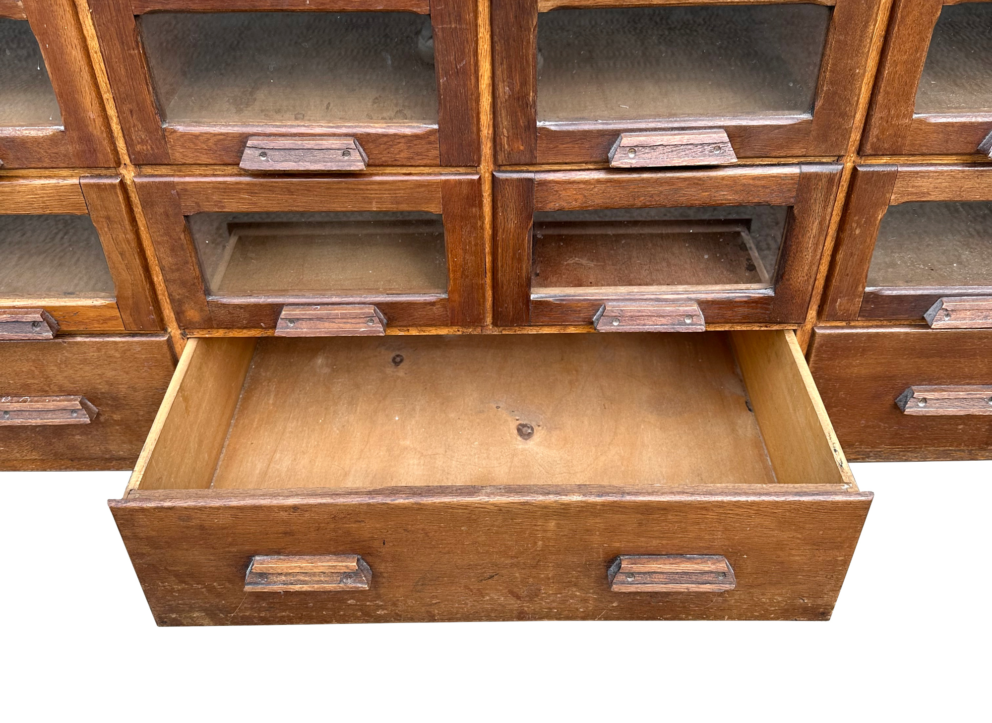 A mid century substantial haberdashery cabinet, with sixty oak fronted glazed drawers, above three - Image 5 of 10