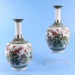 A pair of Chinese famille verte baluster vases, decorated birds and flowering foliage, with six