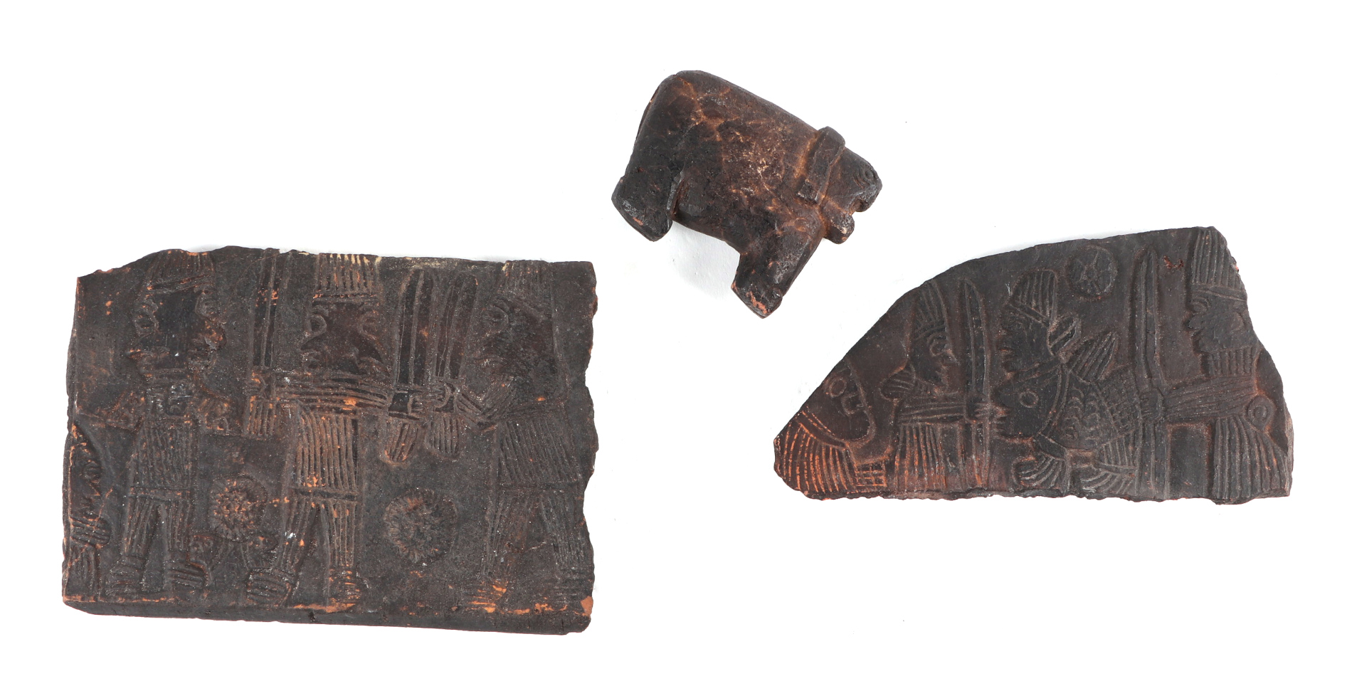 After the antique: two South American pottery tile fragments, with moulded decoration in the form of