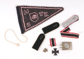 A German SS type pennant, a German belt buckle, epaulettes and other items.