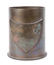 A French Marine Commando brass shell case trophy with a brass shield attached which is engraved: EV2