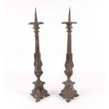 A pair of gothic revival silver plated pricket candle sticks, 56cm high (2).