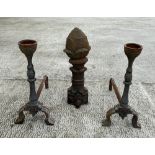 A cast iron pineapple form finial, 54cm high, together with a pair of fire dogs (3).