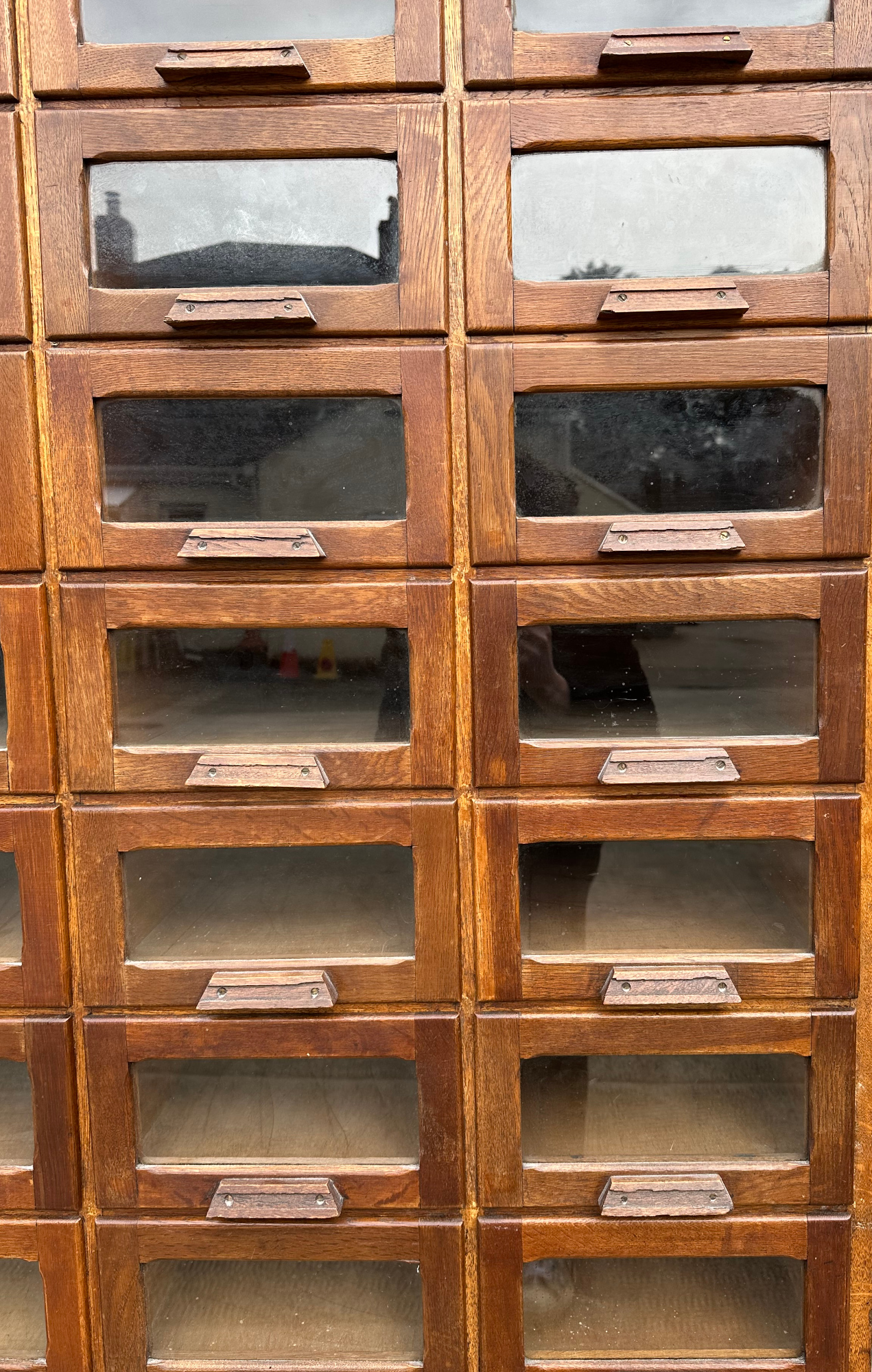 A mid century substantial haberdashery cabinet, with sixty oak fronted glazed drawers, above three - Image 3 of 10