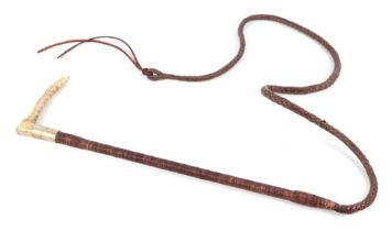A Swaine & Adeney riding / hunting whip With a stag horn handle and leather plaited whip. With