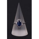 A certificated 18ct white gold oval Kyanite and diamond cluster ring, Kyanite approx 1.77ct,