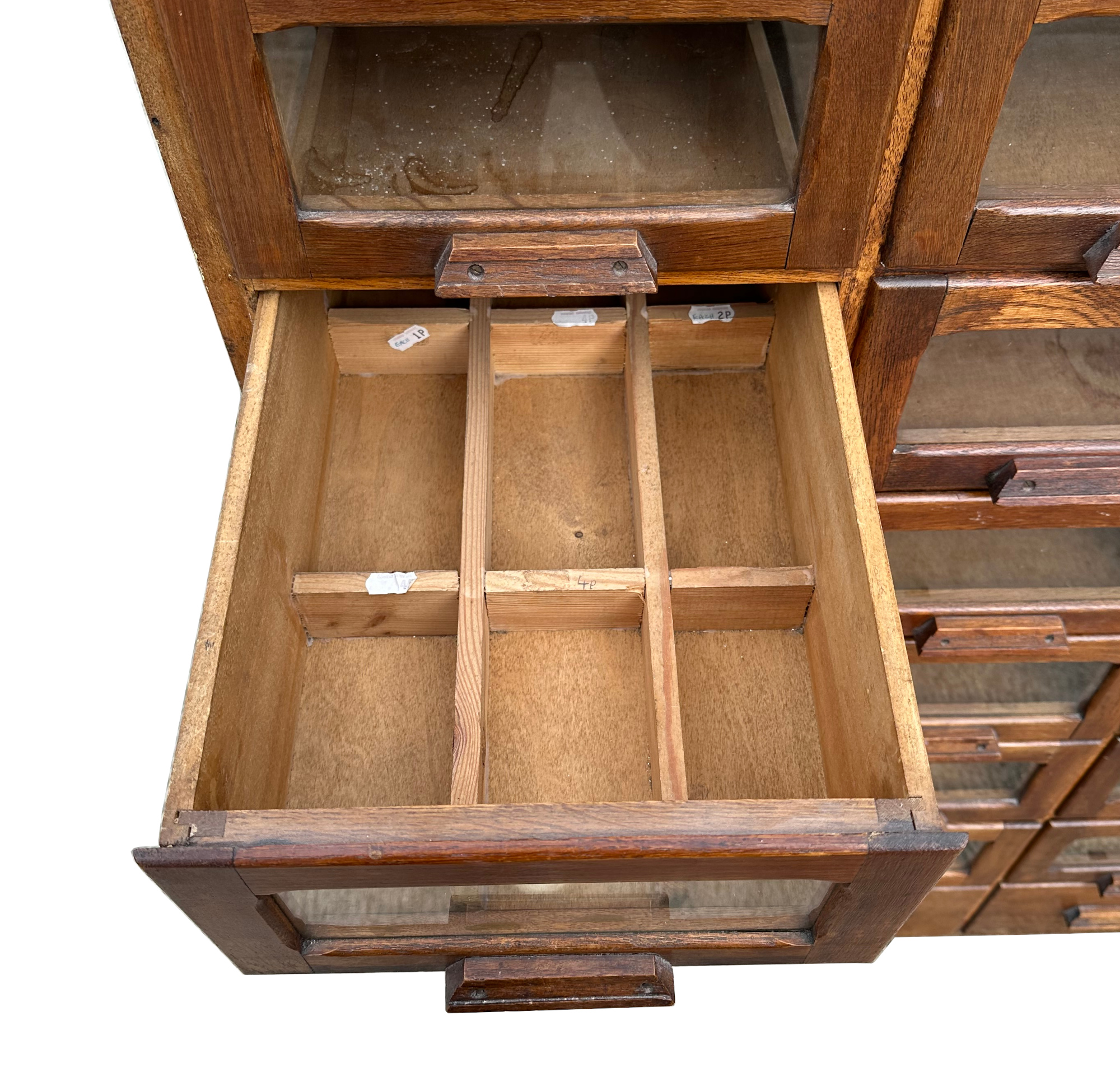 A mid century substantial haberdashery cabinet, with sixty oak fronted glazed drawers, above three - Image 7 of 10