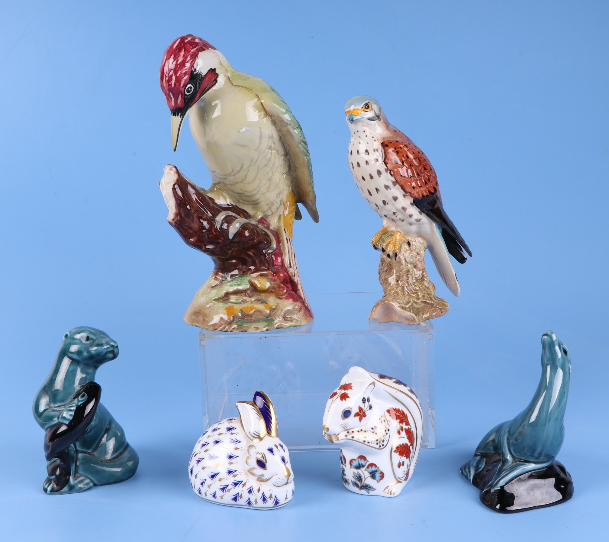 A Beswick wood pecker, 1218 gloss, 22cm high, a Beswick kestrel, 2316 gloss, 17cm high, two Poole