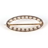 An 18ct gold diamond and pearl oval brooch, 38mm wide, 4.6g, in an associated box.