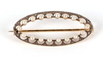 An 18ct gold diamond and pearl oval brooch, 38mm wide, 4.6g, in an associated box.
