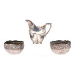 A pair of Indian white metal bowls with chased decoration together with a continental silver (800)