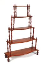 A Victorian walnut five tier whatnot, with barley twist supports, 75cm wide.